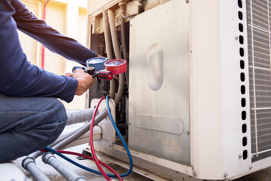 Technician is checking AC Measuring Equipment